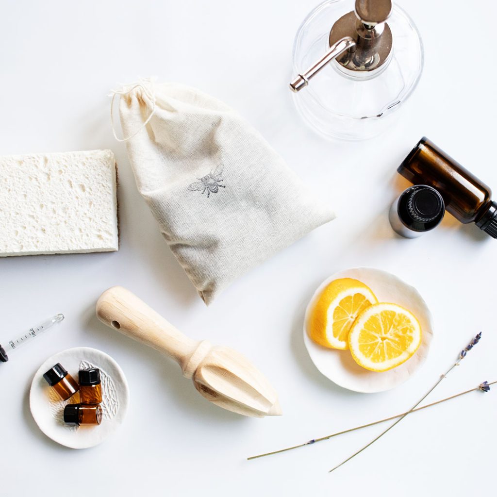 natural cleaning tools on a white countertop